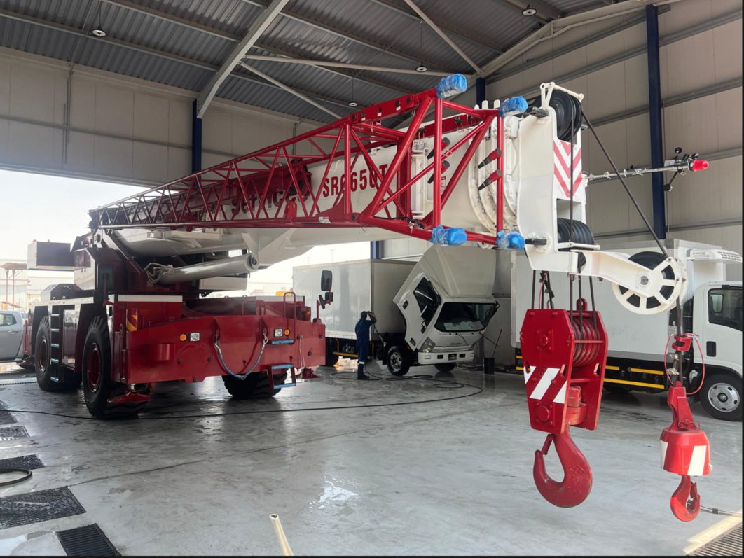Crane in warehouse with extended boom